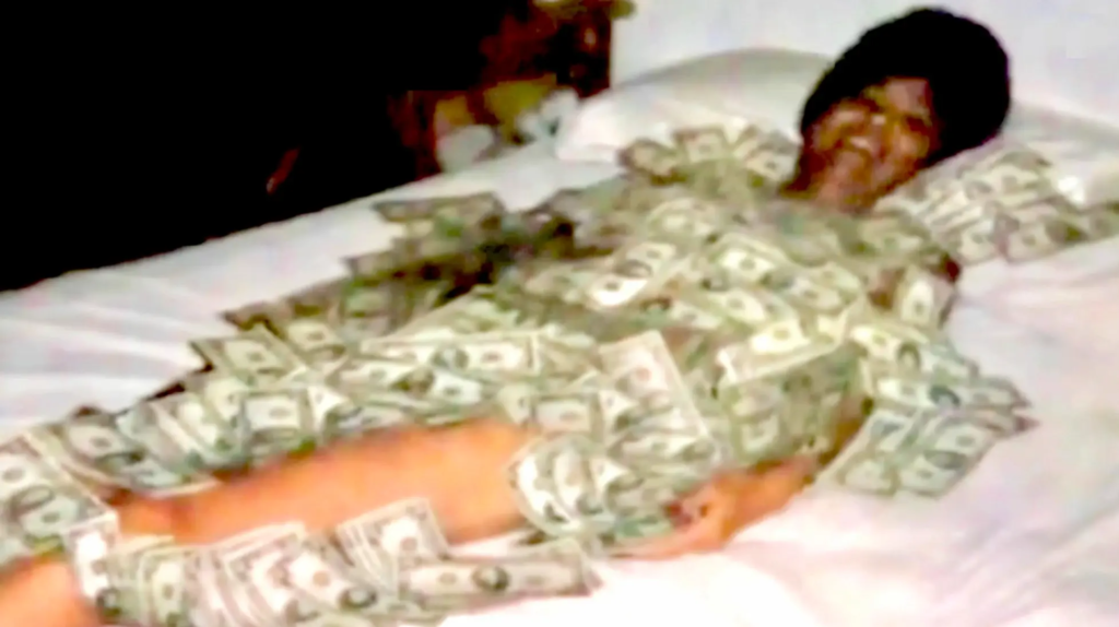 The Twisted Story of Mary Ellen Samuels, The 'Green Widow' Who Paid to Have Her Husband Killed 4 Mary Ellen Samuels lies on a bed covered in $20,000 in $100 bills. Photo: LAPD