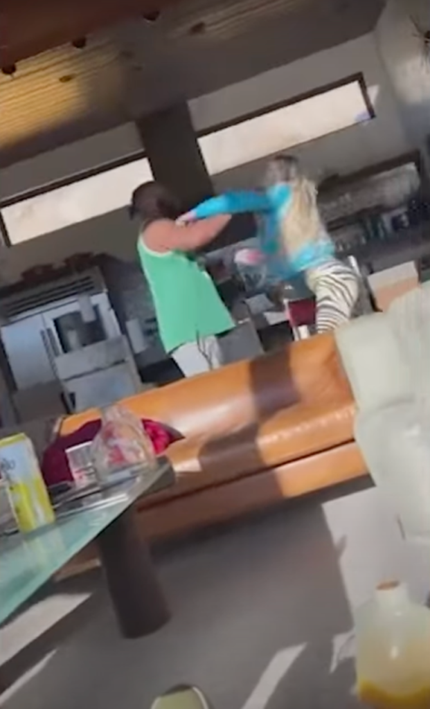 Obumseli blocking Clenney's punches during one of several recorded altercations at their Miami apartment building.