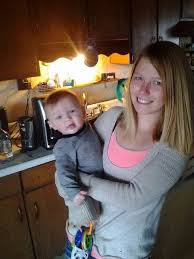 Marina Boelter holds her infant son, Landon, born in April 2014. She lost custody of him four months later and spent the rest of that year trying to get him back.