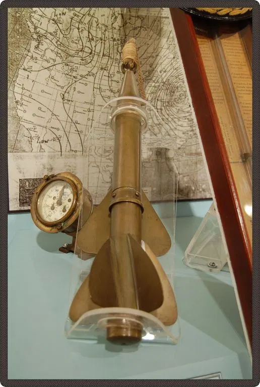 A ship's compass and navigation instruments on display — John Glennie had none of these aboard the upturned Rose-Noëlle. He fixed their position using only a hand bearing compass and aircraft contrails.
