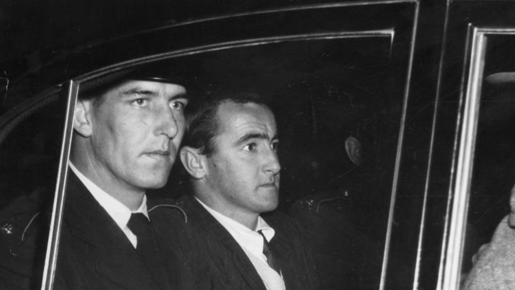 How Raymond John Bailey Was Hanged for the Sundown Murders 3 Raymond John Bailey transported by police to Adelaide to stand trial for the Sundown murders, 1958.