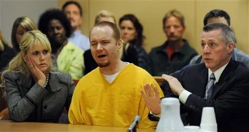 Kenneth Dion, centre, speaks during his sentencing hearing at Anchorage Superior Court, October 31, 2011, flanked by his defence attorney Andrew Lambert, right. Dion received 124 years with no suspended time. Photo: Anchorage Daily News.