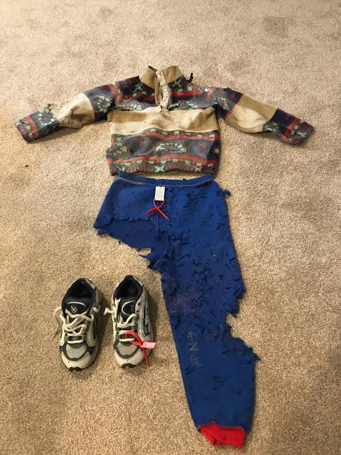The clothing found on the Big South Trail in June 2003, including Jaryd's polar fleece sweater, blue trousers, and sneakers. The trousers were found turned inside out, with one leg almost entirely gone.