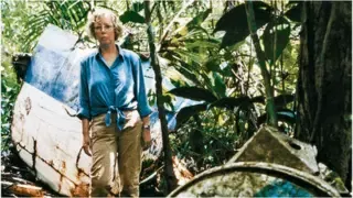 Juliane Koepcke stands among wreckage from LANSA Flight 508 at the crash site deep in the Peruvian Amazon, during filming of Werner Herzog's documentary Wings of Hope, 27 years after she survived the crash on December 24, 1971.