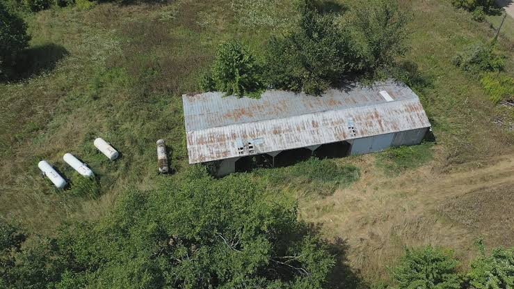Aerial view of the storage building on Dale Warner's farm in Tipton, Lenawee County, Michigan, where Dee Warner's remains were found hidden inside a sealed fertilizer tank in August 2024.