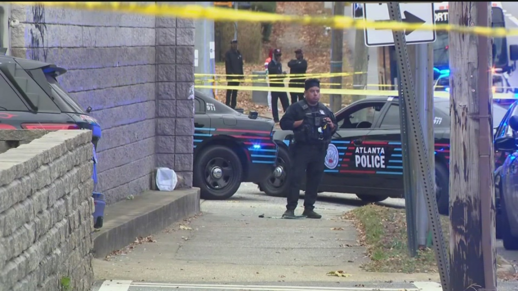 Stephen McDaniel learned police had found Lauren Giddings' body during a live television interview. He had put it there. 4 Atlanta Police officers secure a crime scene, Atlanta, Georgia.