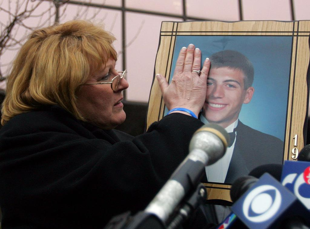 Annette Swanson holds a portrait of her son Brandon at a press conference following his disappearance in May 2008. Her refusal to accept the initial police dismissal of his case drove the passage of Brandon's Law, signed into Minnesota law in 2009.